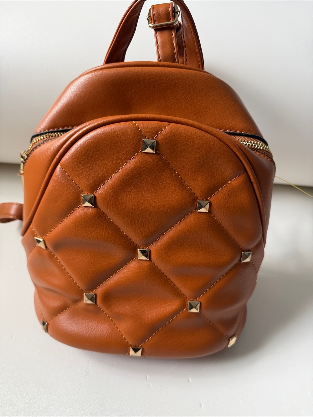 Quilted Mini Backpack in Cognac Brown with Stud Accents
